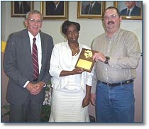 MYRHONDA TURNER was recognized Teacher of the Year by the Claiborne Parish School Board. Superintendent James Scriber and President Will Maddox presented Turner a plaque and lap top computer.