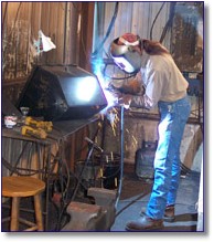 Welder Tim McBride assembles Cajun Fryer products.