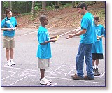 Joey Breaux leads an activity with students to demonstrate how water becomes contaminated.