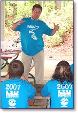 Dr. Bill Owens gestures as he discusses waterlife at the Fifth Annual Water Fest at Lake Claiborne.